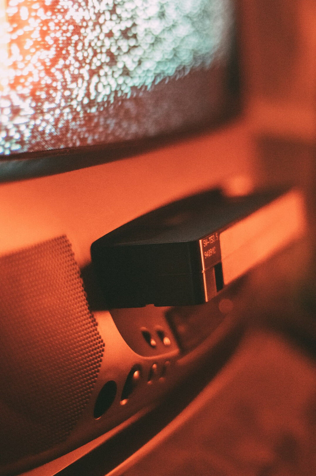 Teleprompter screen with studio lights in the background