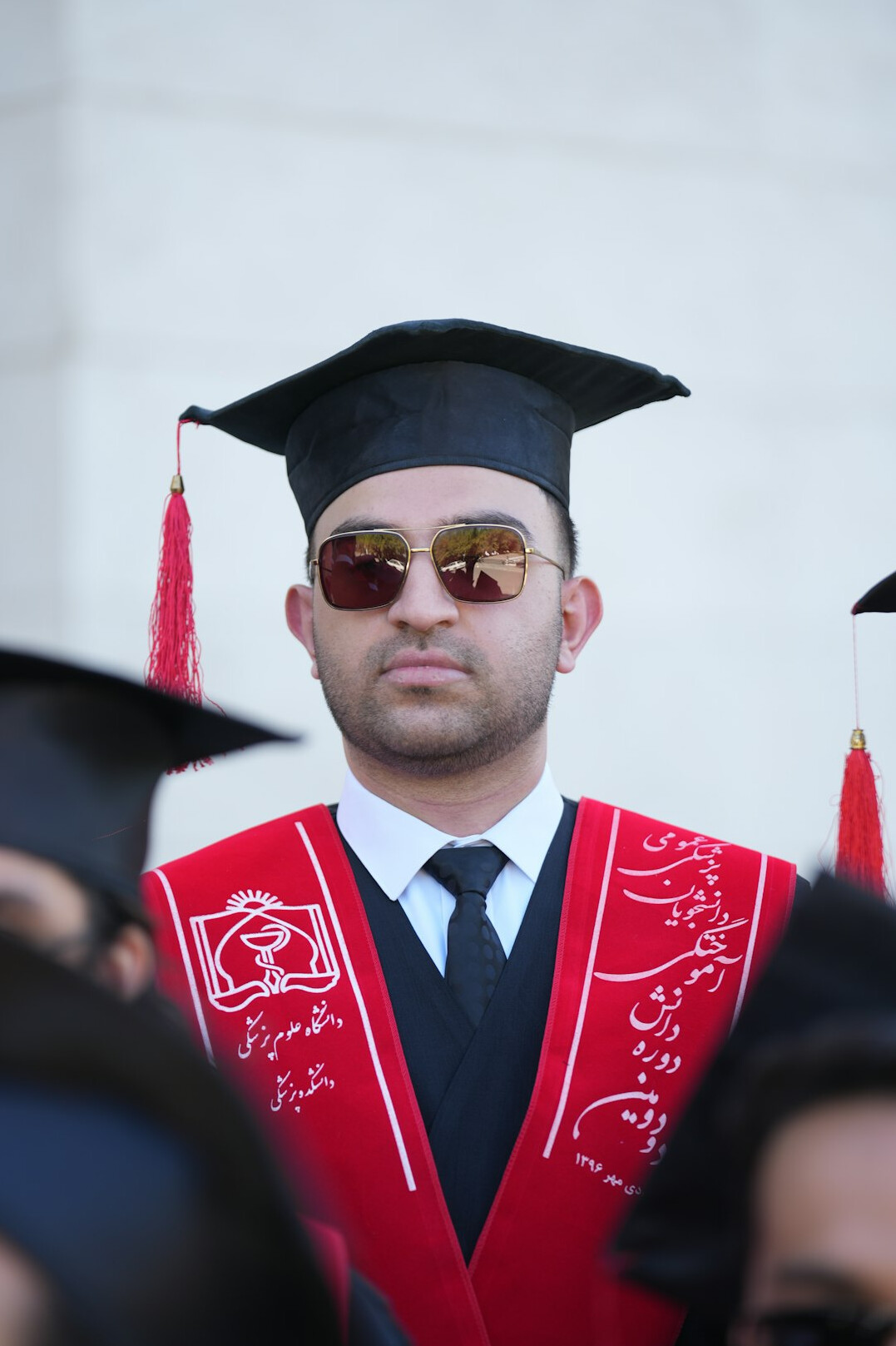 Young Polish man TV news anchor graduate portrait